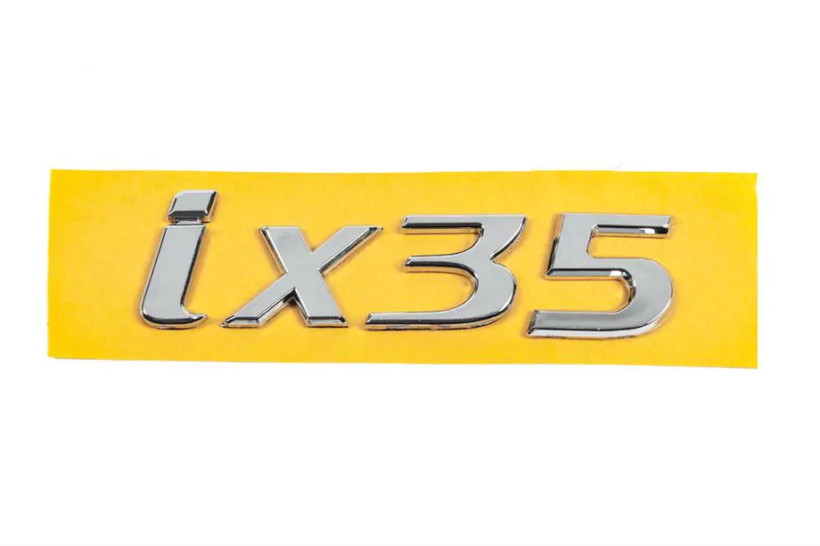 Hyundai IX-35 2010–2015 IX35 opschrift/embleem 86310-2S010 (135 x 37 mm) Image