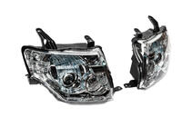 Mitsubishi Pajero Wagon IV 2006–2021 OEM-koplampen (2 stuks) foto 2