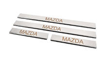 Mazda 2 2003–2007 Instaplijsten Carmos (set van 4, RVS) V-3 foto 2
