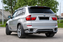 BMW X5 E70 2007–2013 Achterbumper diffuser inzetstuk (2010-2013, spuitklaar) foto 1