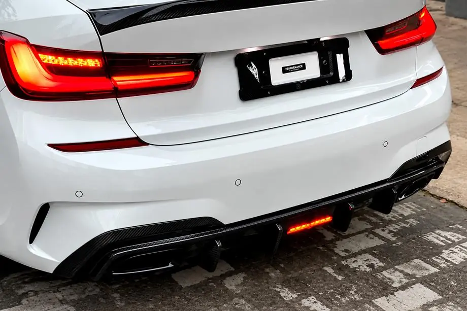 BMW 3 Serie G20/G21 2018– Achterbumper diffuser V6 (voor M-Sport 2018-2022, carbon) Foto 1