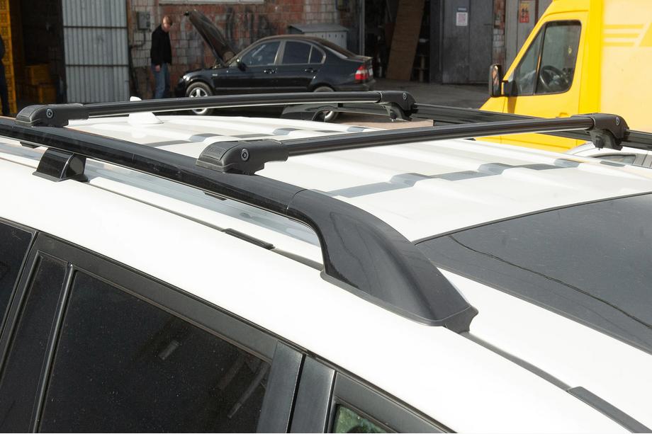 Kia Carnival 2021– Dakdragers (dwarsdragers) voor standaard dakrails, afsluitbaar met sleutel, WingBar V1 (2 stuks) tot 110 cm, zwart Foto 5