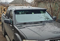 Nissan Navara 2006–2015 Voorruitvizier (op frame) foto 1
