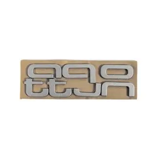 Quattro Grey embleem foto 2