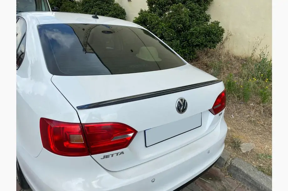 Volkswagen Jetta 2011–2018 LIP-spoiler (Sunplex, zwart) (115,8 cm x 6,3 cm) Foto 1